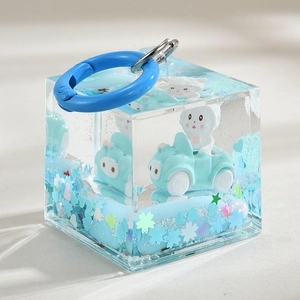 Creative liquid quicksand bottle keychain featuring blue car character and star sequins