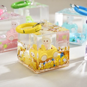 Cartoon liquid quicksand keychain with cute rabbit and yellow star glitter inside