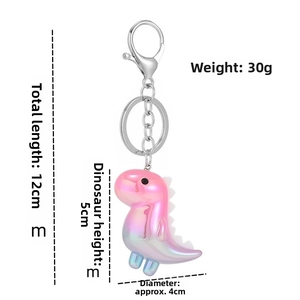 Detailed view of pink gradient dinosaur keychain with 12cm length and 30g weight measurements