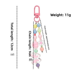 Macro view of macaron beaded charm with butterfly pendant and size measurements