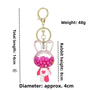 Pink acrylic bunny keychain detail with dimensions and polished gold lobster clasp