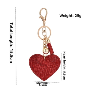 Detailed view of red heart rhinestone keychain with tassel and size measurements
