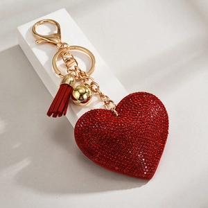 Red heart keychain with sparkling rhinestones, golden hardware and suede tassel charm