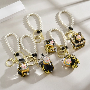 Lot de 5 porte-clés créatifs cochon flottant avec paillettes dorées et perles blanches