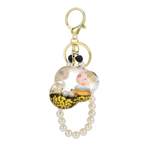 Porte-clés nuage avec sable mouvant, petit cochon rose, étoiles dorées et perles