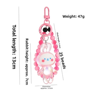 Pendentif lapin rose avec détails de mesure: 13cm de long, 7cm de haut et 47g