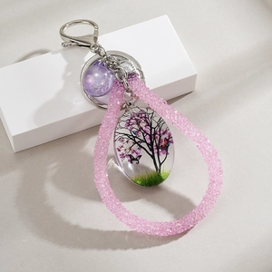 Pink crystal Tree of Life keychain with drop pendant and butterfly design for bags