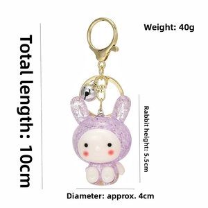 Mini purple resin bunny keychain with glitter finish and product dimensions detail