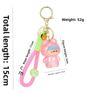 Pink cartoon girl keychain set with size dimensions, silicone strap and gold lobster clasp