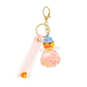 Luminous floating duck keychain with pink glitter spheres and blue fish hat charm