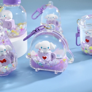 Close-up of Cinnamoroll liquid quicksand keychain with purple glitter and charms