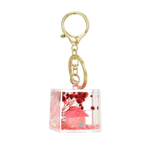 Creative transparent cube keychain with pink house model and glitter inside