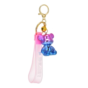 Cute holographic electroplated bear keychain with pink silicone strap and gold bell charm