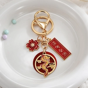 Chinese dragon year lucky keychain with red cherry blossom and gold blessing charm