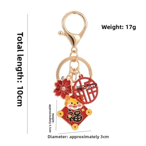 Detail of 10cm Chinese New Year zodiac keychain with red enamel charms and gold plating