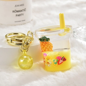 Creative fruit tea cup acrylic keychain with floating strawberry and pineapple slices