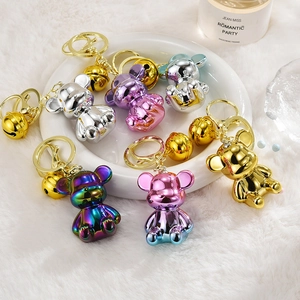 Metallic gradient bear keychains with golden bells in various electroplated colors