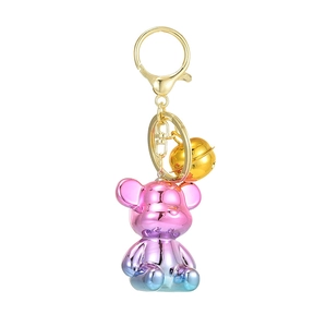 Pink and blue gradient acrylic bear keychain with gold bell and metallic finish