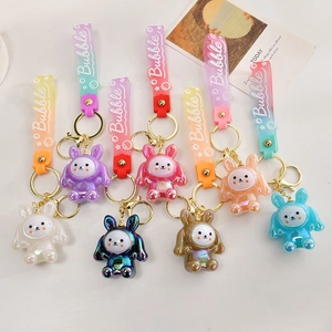 Creative glowing rabbit keychain set with colorful acrylic bunnies and Bubble wrist straps