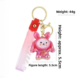 Detail view of pink acrylic bunny keychain with dimensions 5.5cm and Bubble wrist strap