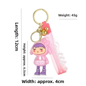 Pink cartoon girl keychain with dimensions showing 12cm length and 6.5cm height detail