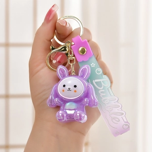 Handheld purple glowing rabbit keychain with Bubble acrylic strap and gold hardware