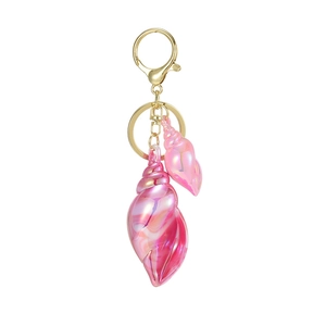 Iridescent pink conch shell keychain with gold hardware on a clean white background