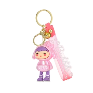Cute pink soft rubber girl keychain with bubble strap and golden bell charm for bags