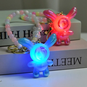 Luminous long-eared rabbit keychain set with LED lights and acrylic rainbow beads