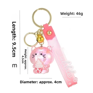 Pink resin cat keychain dimensions detail showing 9.5cm length with gold bell and strap