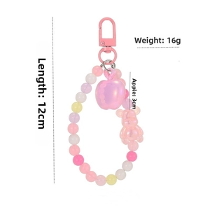 Dettaglio ciondolo di perline rosa con mela, lunghezza 12cm e peso di 16g