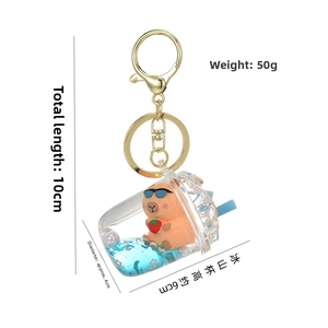 Detailed view of Capybara quicksand keychain showing size dimensions and golden lobster clasp
