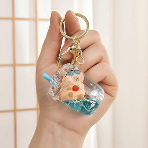 Detail of creative Capybara liquid quicksand keychain in a milk tea cup with stars