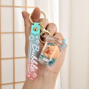 Cute Capybara liquid quicksand keychain with blue sequins and soft gradient wrist strap