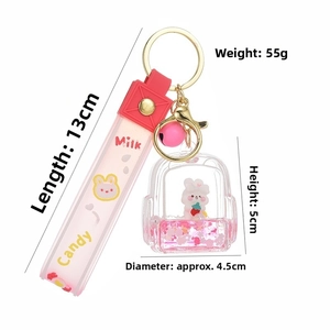 Detail of creative strawberry rabbit oil liquid keychain with dimensions and pink bell strap