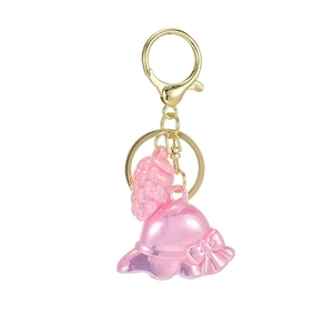 Pink bow hat and grape charm keychain with golden clasp and acrylic components