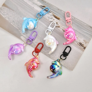 Colorful acrylic dolphin keychains in six gradient shades for bags and keys