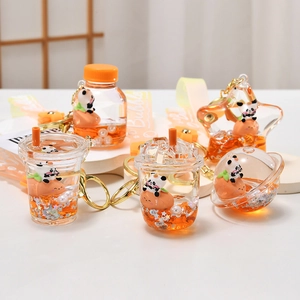 Creative panda liquid quicksand keychains with orange fruit charms and bubble straps