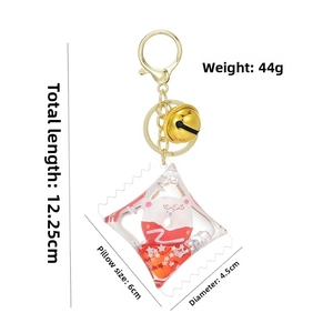 Detail of creative bear donut liquid keychain with stars and red fluid in pillow case