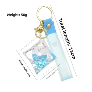 Blue liquid quicksand keychain featuring a bear donut in candy bag packaging with dimensions