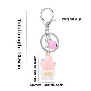 Pink resin cactus keychain with dimensions showing 10.5cm length and 21g weight