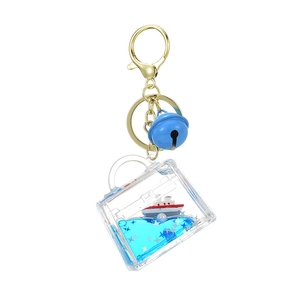 Ocean sailboat drifting bottle keychain in clear suitcase shape with blue liquid and glitters