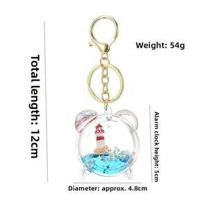 Detailed dimensions of blue lighthouse quicksand keychain with silver star sequins