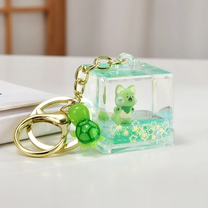 Cute green cat liquid quicksand acrylic keychain with turtle pendant and gold hardware