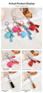 Detailed view of colorful heart charms with tassels and silver clasps for bag accessories