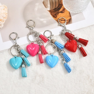 Silver lobster clasp heart keychains with triple fringe tassels in four vibrant colors