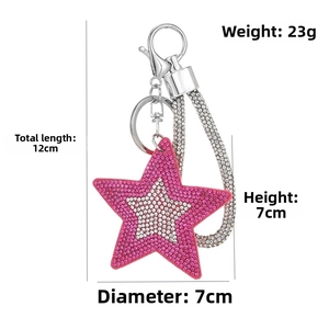 Pink rhinestone star keychain with glitter strap and silver metal clasp detail