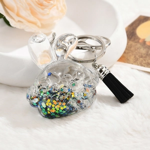 Creative rabbit oil liquid keychain with star sequins and a black tassel charm