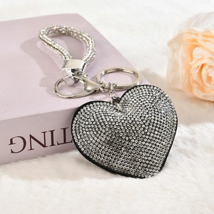 Detailed view of heart-shaped rhinestone keychain with sparkling crystal wrist strap