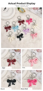 Detail of acrylic bow-knot charms in various colors including burgundy and pink